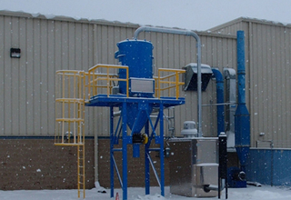 Industrial vacuum system installed at a paint powder manufacturing facility.