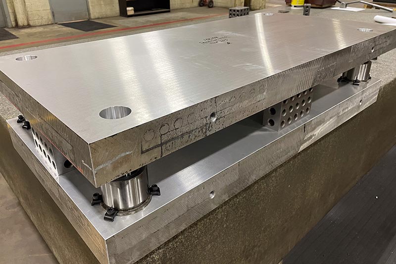 Aluminum die set with precision-machined plates.