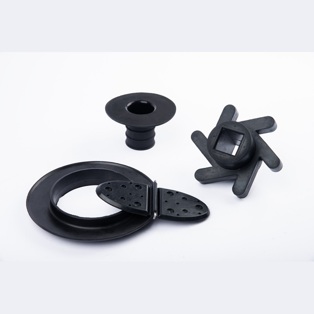 Industrial Products23 image showing black molded rubber components in ring-shaped, flanged and flexible forms.