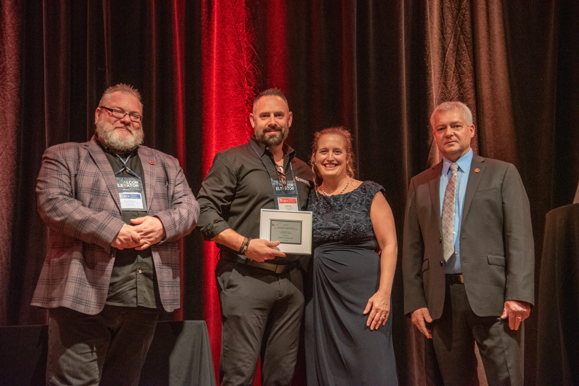 CECA members recognized on stage during an industry awards presentation at the annual convention.