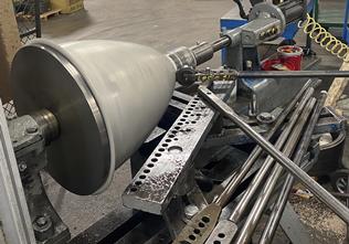 Manual metal spinning equipment shown in the virtual tour.