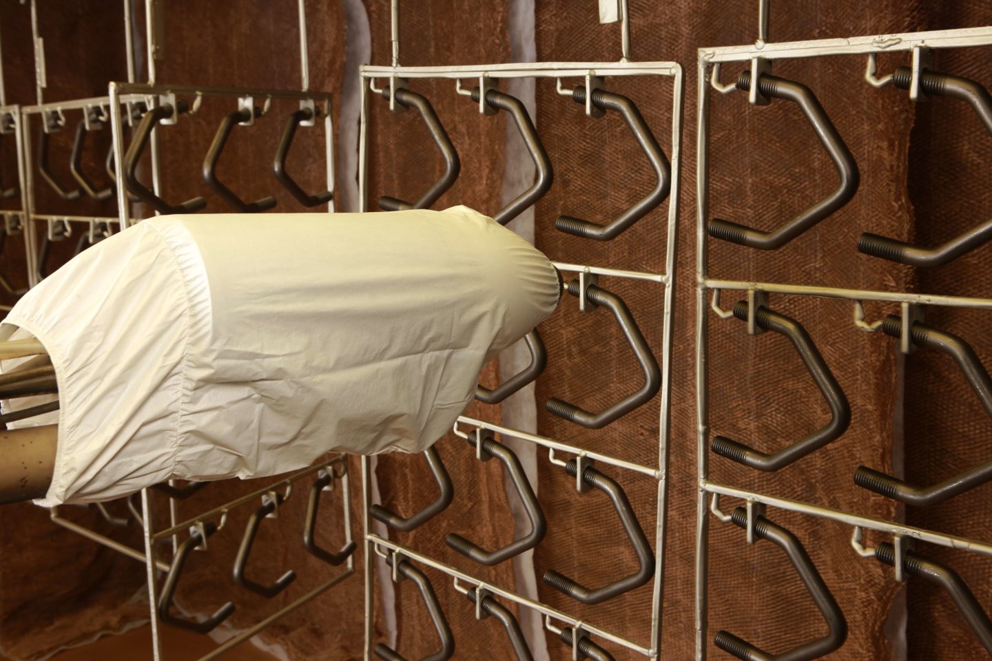 Rack-spray electrostatic coating application