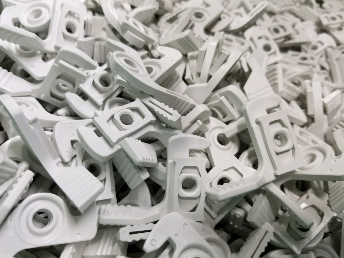 Bulk production of precision plastic injection molded components showcasing uniform geometry, clean edges, and high repeatability suitable for industrial and consumer applications.