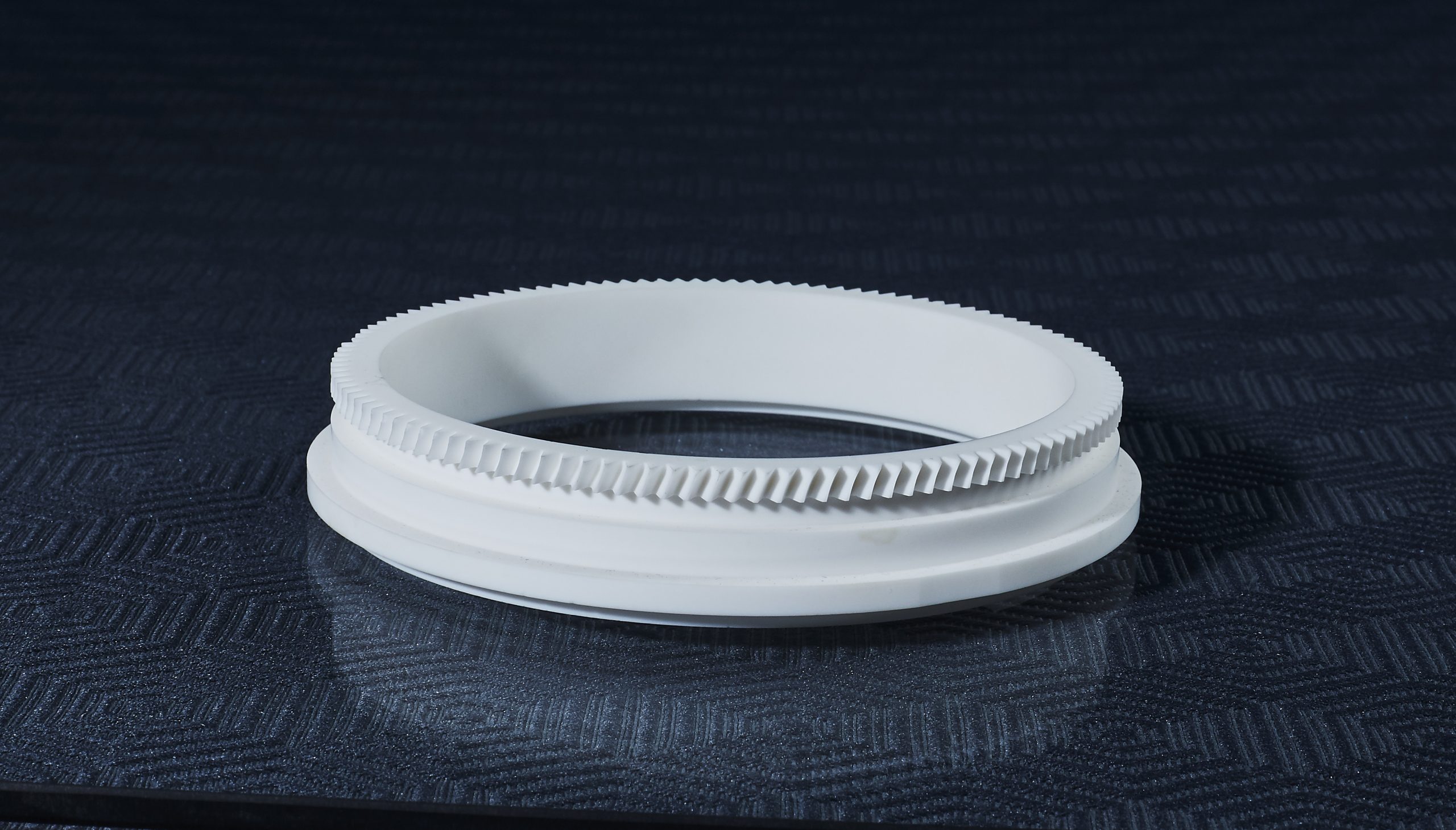 MACOR glass-ceramic ring with precision gear teeth, CNC machined features and finish ground