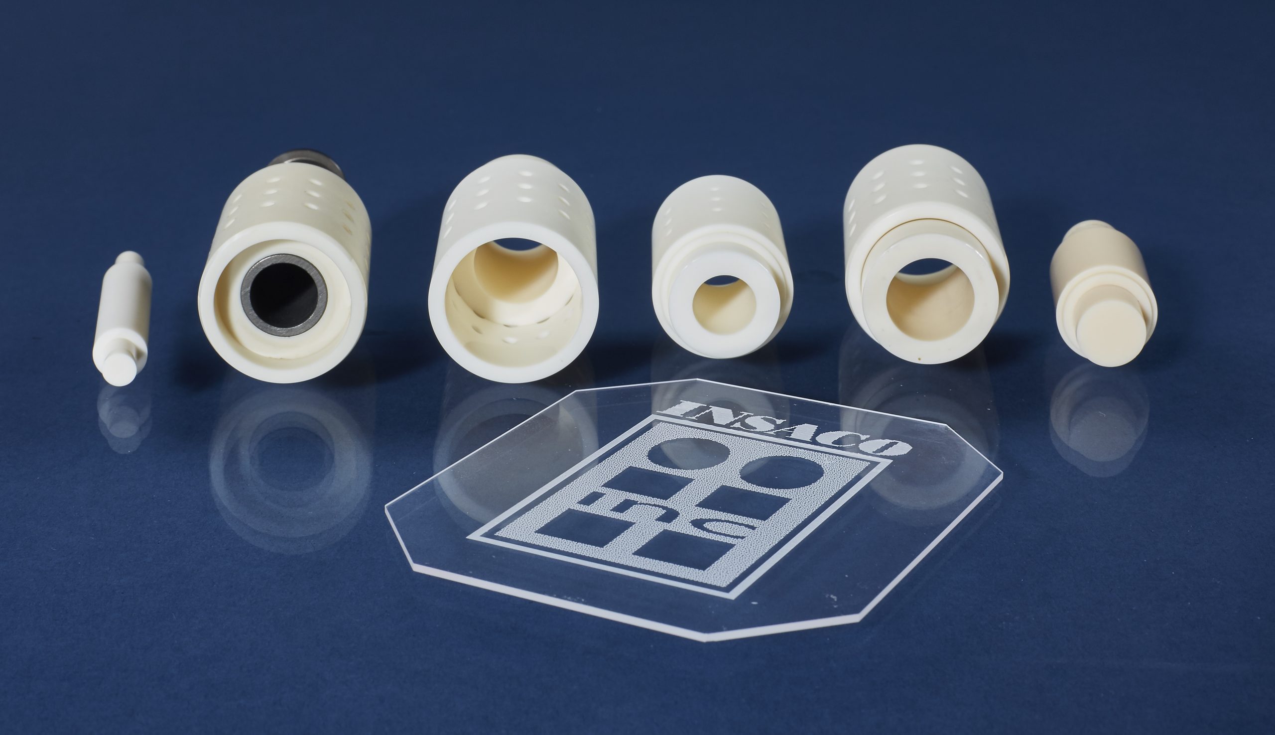 Technical ceramic sleeves and bushings with precision-bored IDs and radial ports, post-fired CNC diamond machining for tight concentricity