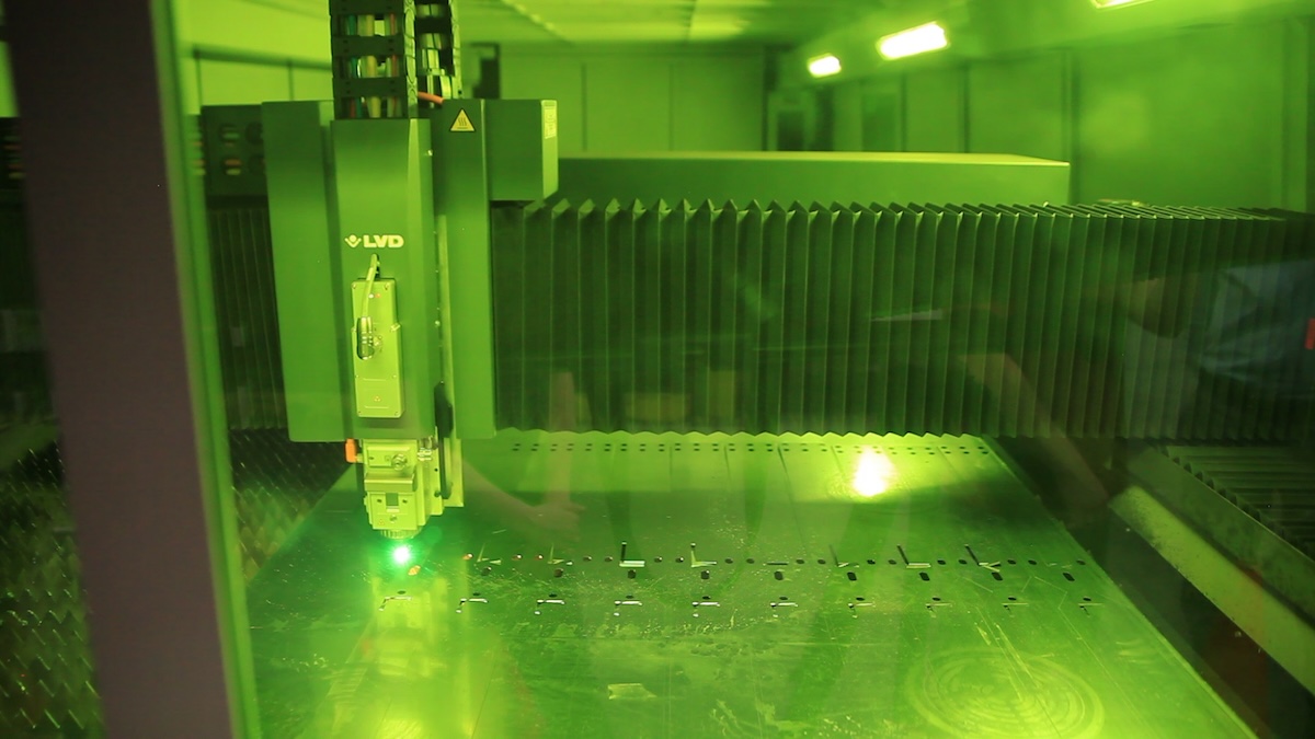 Interior view of an LVD fiber laser cutting machine processing sheet metal.