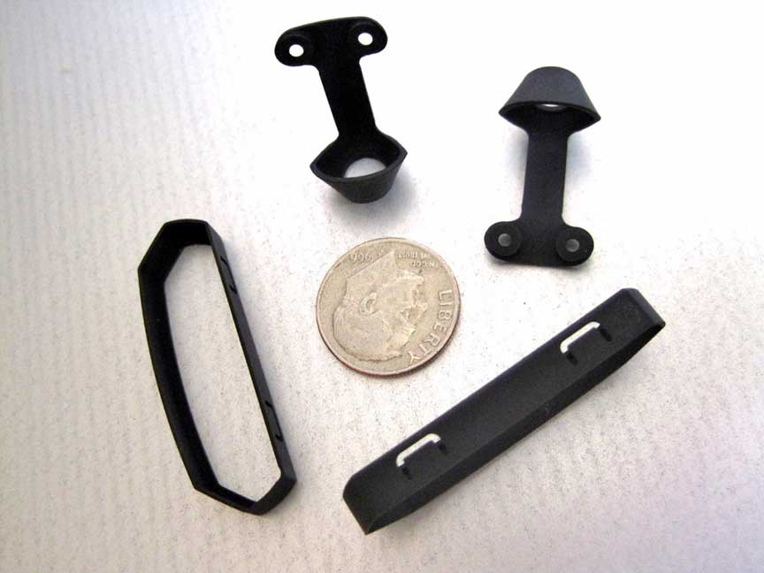 Micro CNC machined anodized parts with fine detail and tight tolerances.