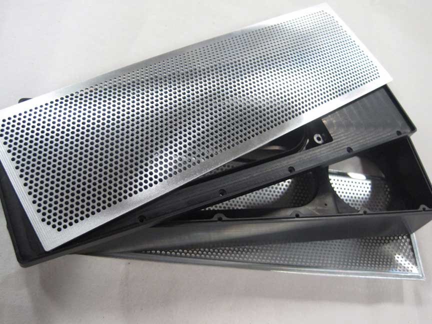 CNC machined perforated aluminum enclosure for electronic and acoustic use.