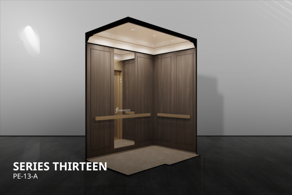Prestige Series 13A elevator cab interior with dark wood laminate panels, mirror panel, gold handrail, and carpet flooring.