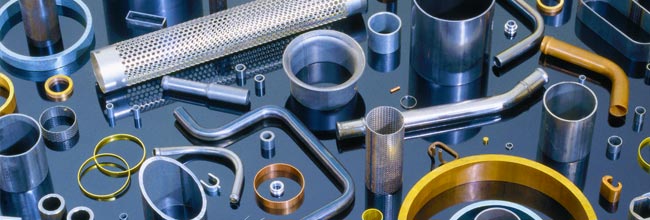 Tube cutting, tube forming, and tube machining services depicted on the tube cutting page.