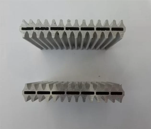 Custom aluminum extrusion with slotting, machining, and downstream finishing support.