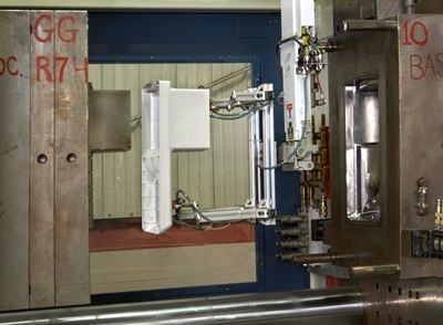 Injection molding machine used for plastic part production.