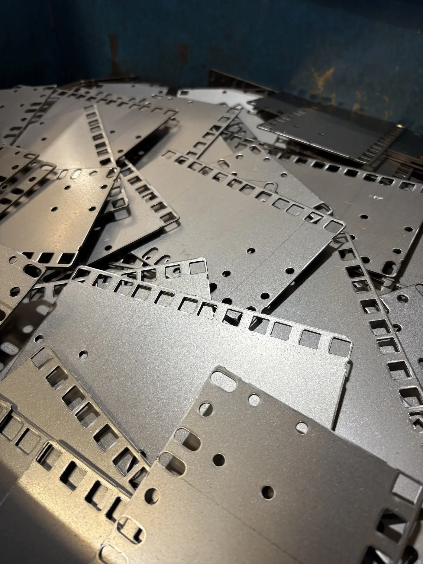 Punched sheet metal parts illustrating the CNC Punching capability.