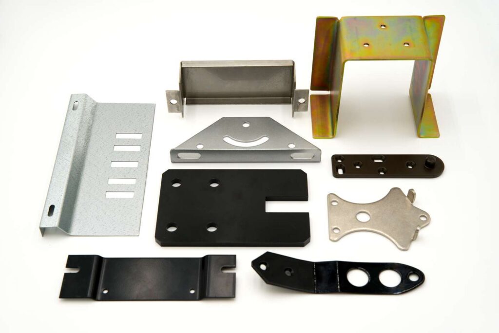 Stamping & Forming service image showing high-speed progressive stamping, complex wire forming, and press brake bending.